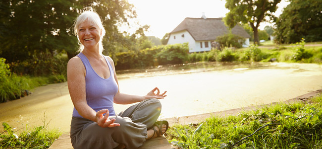 Senior woman doing yoga outside in Marietta, OH