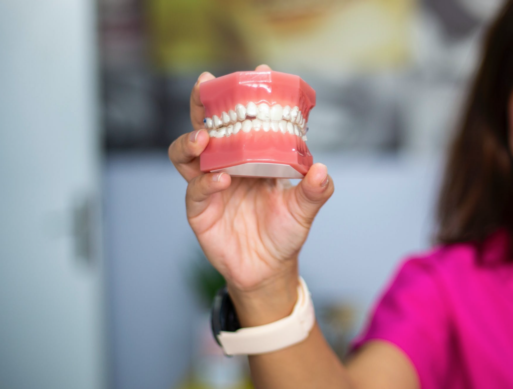lady holding up false teeth